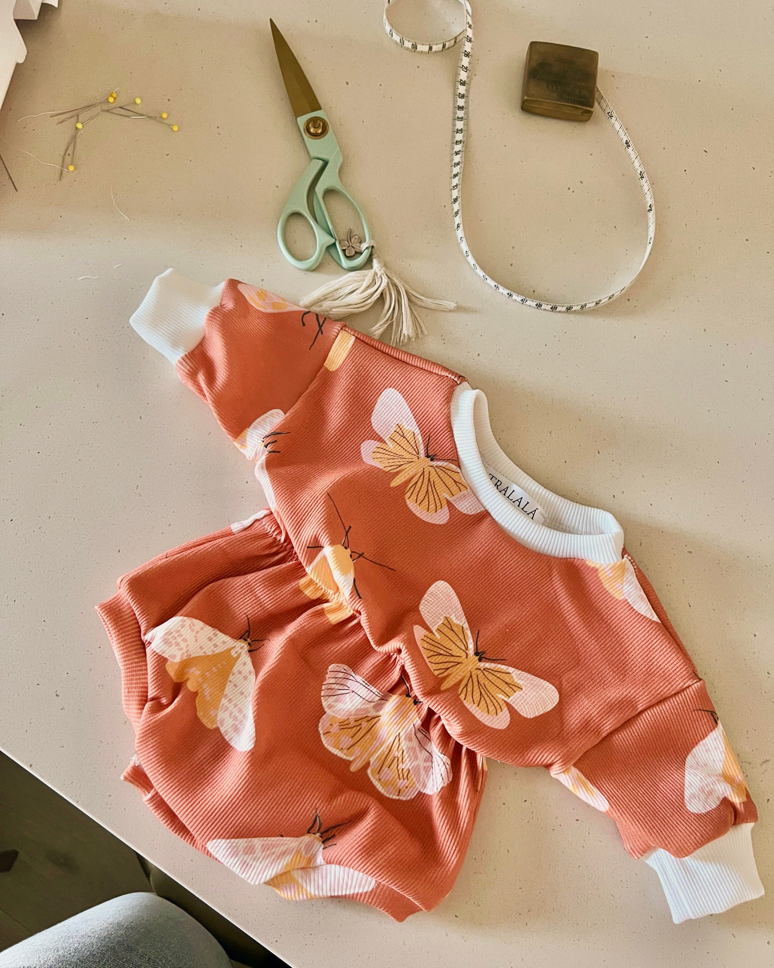 Picture of toddler clothing with butterflies in the design